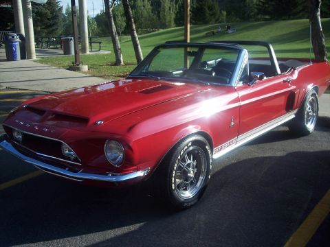 1972 Ford Ranchero - Red 1968 Ford Mustang convertible parked outdoors, showing GT350 badging and hood scoop.