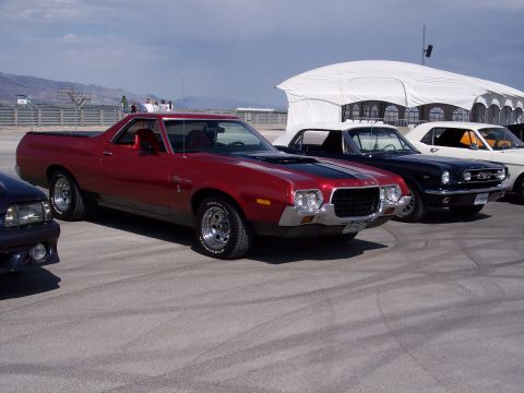 1972 Ford Ranchero - A red 1972 Ford Ranchero is parked in a line with other classic vehicles.