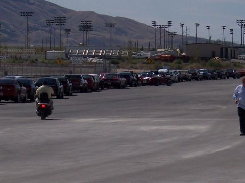 1972 Ford Ranchero - A line of cars is parked in a lot, with a scooter visible in the foreground.