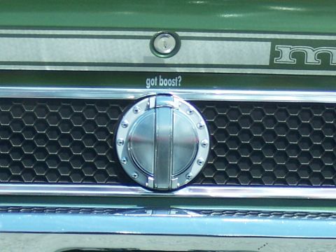 1972 Ford Ranchero - Close-up of a green vehicle's front grille, a honeycomb pattern and a "got boost?" sticker.