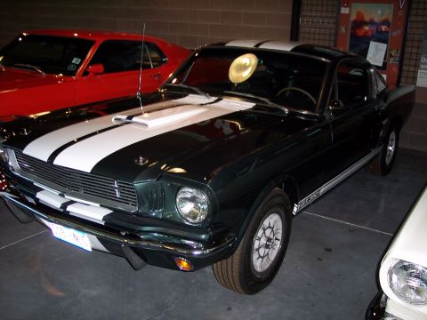 1972 Ford Ranchero - Dark green 1965 Ford Mustang GT350 is shown with white racing stripes and a scoop.