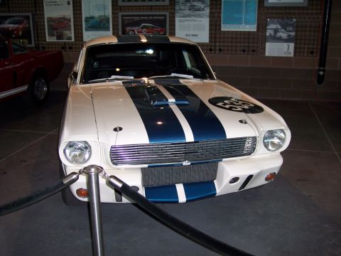 1972 Ford Ranchero - White 1965 Ford Mustang Shelby GT350 race car with blue stripes and a number 55 on the hood.