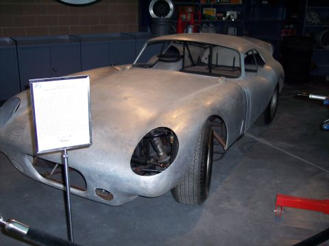 1972 Ford Ranchero - This unpainted race car, possibly a custom build, is displayed indoors with informational signage.