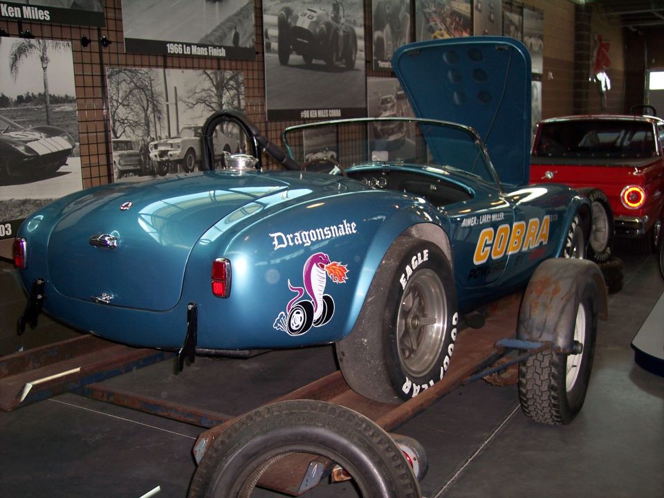 Blue Cobra roadster rear 3/4 view with Dragonsnake decal, on museum display
