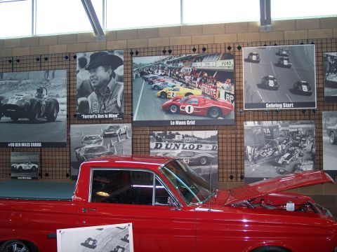 1972 Ford Ranchero - A red pickup truck is displayed with its hood open, the engine bay.