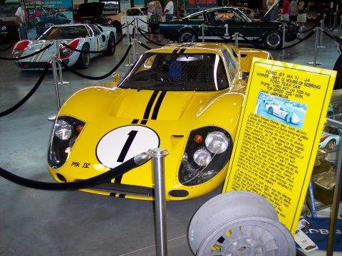 1972 Ford Ranchero - A yellow 1967 Ford GT Mk IV race car is displayed with a descriptive plaque.