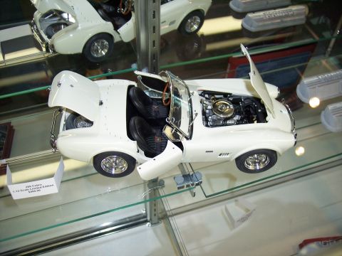 1972 Ford Ranchero - A detailed model car is displayed on a glass shelf, with its engine and interior exposed.