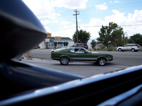 1972 Ford Ranchero - A green 1971-1973 Ford Mustang Mach 1 is seen driving past a Denny's restaurant.