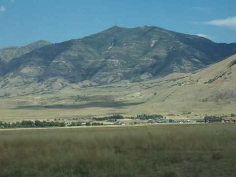 1972 Ford Ranchero - A wide view of a mountain landscape with a small settlement in the distance.