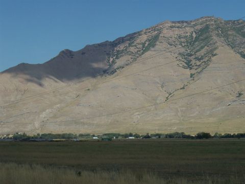1972 Ford Ranchero - A vast mountain range dominates the background, with power lines stretching across the landscape.
