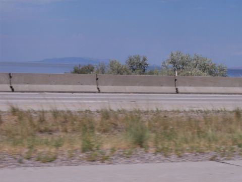 1972 Ford Ranchero - A view from a highway shows a concrete barrier, dry vegetation, and distant mountains.