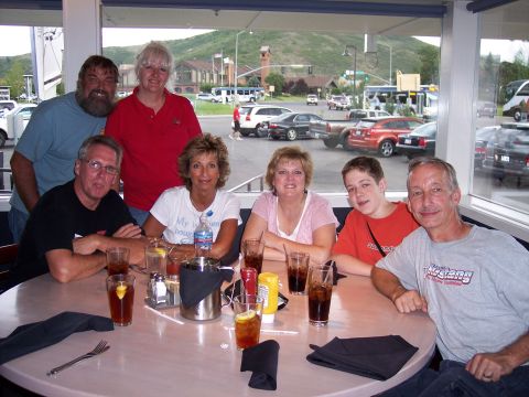 1972 Ford Ranchero - A group enjoys a meal together while observing the activity outside the restaurant window.