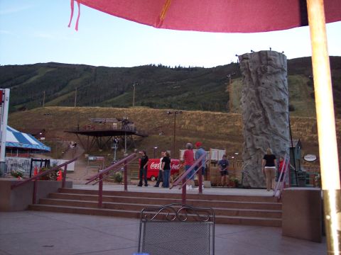 1972 Ford Ranchero - A scene of outdoor recreation with a climbing wall and ski slopes, people near a Coca-Cola stand.