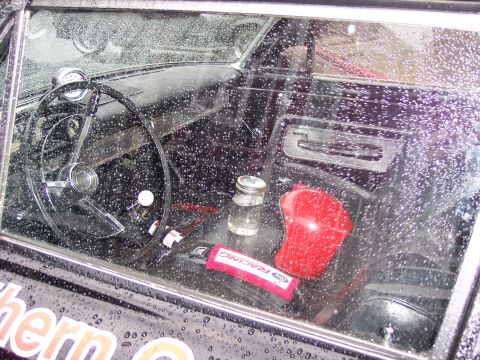 1972 Ford Ranchero - Interior view of a 1972 Ford Ranchero, equipped with a racing harness and aftermarket gauges.