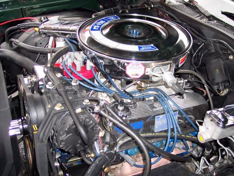 1972 Ford Ranchero - The engine bay of a 1972 Ford Ranchero displays its V8 engine with a prominent chrome air cleaner assembly.