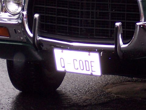1972 Ford Ranchero - The front of a vehicle is shown, a license plate with the text "Q-CODE".