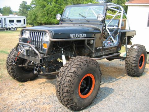 1992 Ford Mustang - This heavily modified Jeep Wrangler features oversized off-road tires and a custom roll cage.