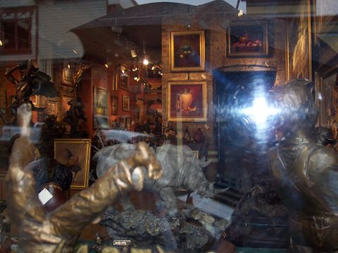 1972 Ford Ranchero - Shop window displays bronze sculptures of animals and people.