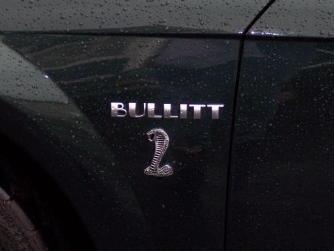 1972 Ford Ranchero - A close-up of a Bullitt badge on a dark green vehicle, possibly indicating a special edition model.