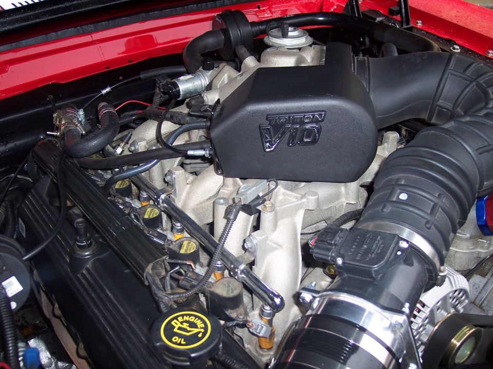 Ford Triton V10 engine bay with black intake cover and red hood