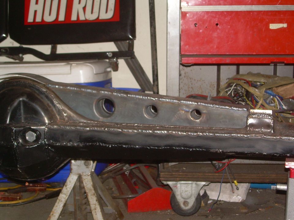 Rear axle housing with gusseted front, on jack stands