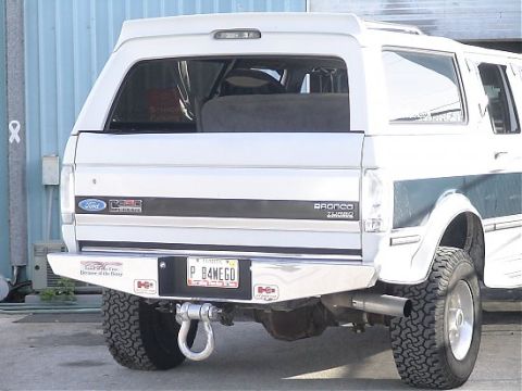 1993 Ford C-350 (Centurion Conversions) - This Ford Bronco has a custom rear bumper and a 'Bronco Turbo' badge visible.