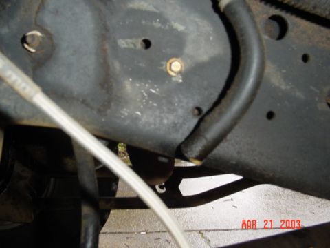 1989 Ford Bronco - This id the hose that goes to the valve cover, notice I dump it at the frame ...See the yellow goo on the end of the hose