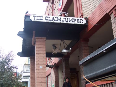 1972 Ford Ranchero - The entrance to The Claimjumper building features a prominent sign and decorative spurs hanging from chains.