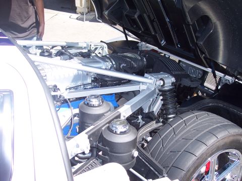 1972 Ford Ranchero - The engine compartment reveals a powerful supercharged V8, intricate engineering and performance parts.