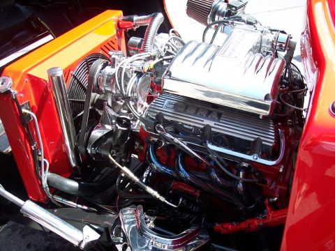1972 Ford Ranchero - A highly polished V8 engine with chrome accents and a prominent 'COBRA' inscription on the valve covers.