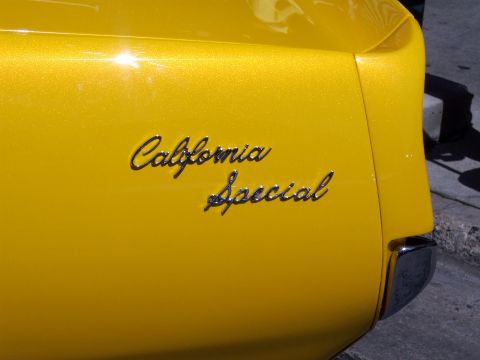 1972 Ford Ranchero - Close-up of the rear quarter panel of a yellow vehicle displaying 'California Special' badging.