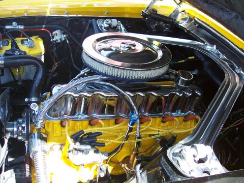 1972 Ford Ranchero - Engine bay detail with chrome accents and yellow paint on the engine block.