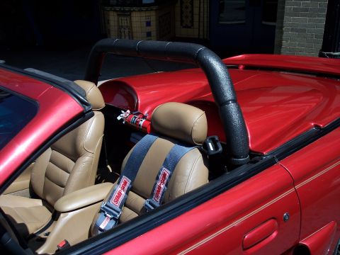 1972 Ford Ranchero - Interior view of a red convertible, equipped with racing harnesses and a fire extinguisher.