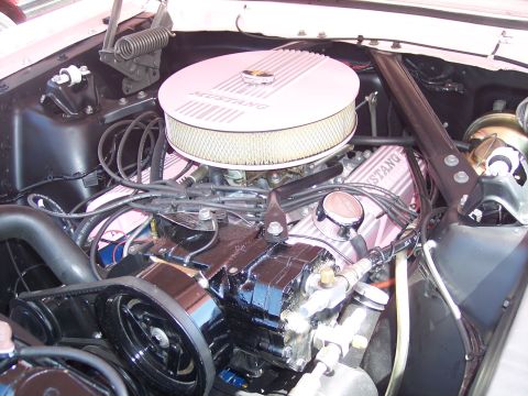 1972 Ford Ranchero - Close-up view of a car's engine bay, a prominent air filter and valve covers.