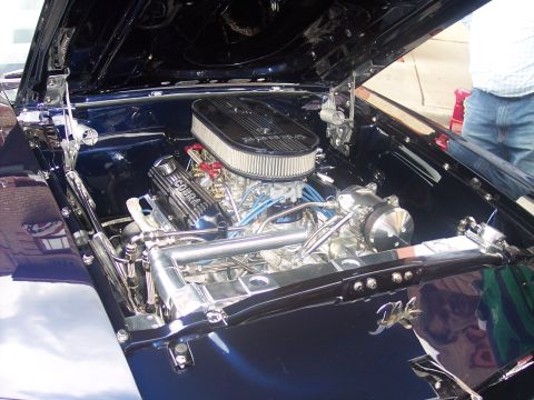 1972 Ford Ranchero - The engine bay of a classic car gleams with chrome and polished surfaces, its powerful V8 engine.