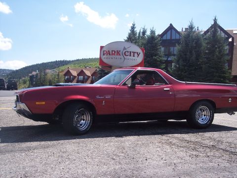 1972 Ford Ranchero - A red 1972 Ford Ranchero is parked in front of the Park City Mountain Resort sign.