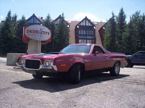 1972 Ford Ranchero - This red Ford Ranchero, likely from the early 1970s, is parked outside the Park City Mountain Resort.