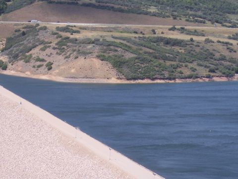 1972 Ford Ranchero - Several vehicles are visible on a highway in the distance, overlooking a large body of water and a dam.