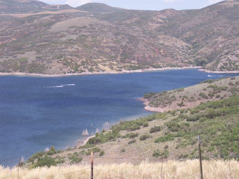 1972 Ford Ranchero - A scenic view of a lake surrounded by rolling hills under a clear sky.