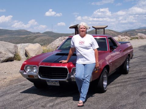 1972 Ford Ranchero - A woman poses with her red Ford Ranchero on a scenic overlook.