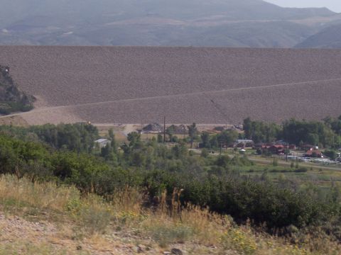 1972 Ford Ranchero - A wide view of a large dam wall, with a small settlement visible in the valley below.