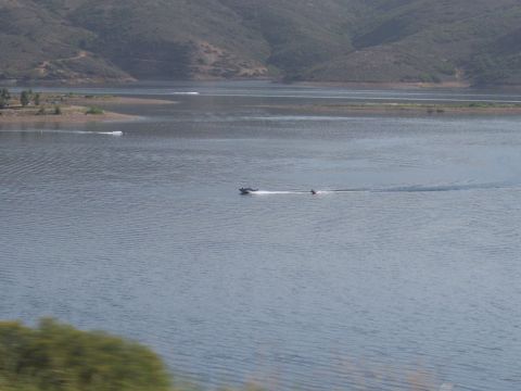 1972 Ford Ranchero - Jet ski activity on a wide expanse of water with rolling hills in the distance.