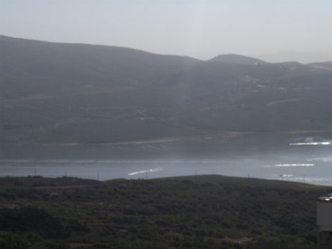 1972 Ford Ranchero - Distant view of hills and water under a hazy sky, with some structures visible on the horizon.