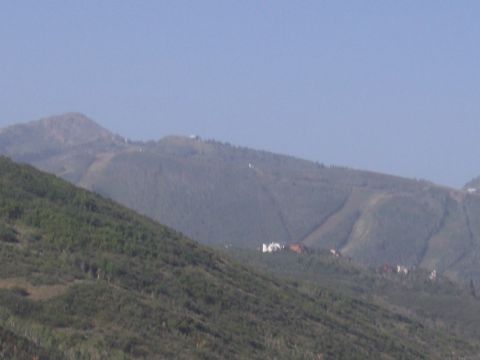 1972 Ford Ranchero - A wide view of a mountain range with trees and several buildings visible on the slopes.