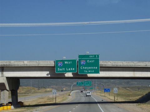 1972 Ford Ranchero - Overhead highway signs indicate directions for I-80 West to Salt Lake City and I-80 East to Cheyenne, with a white van visible on the road…