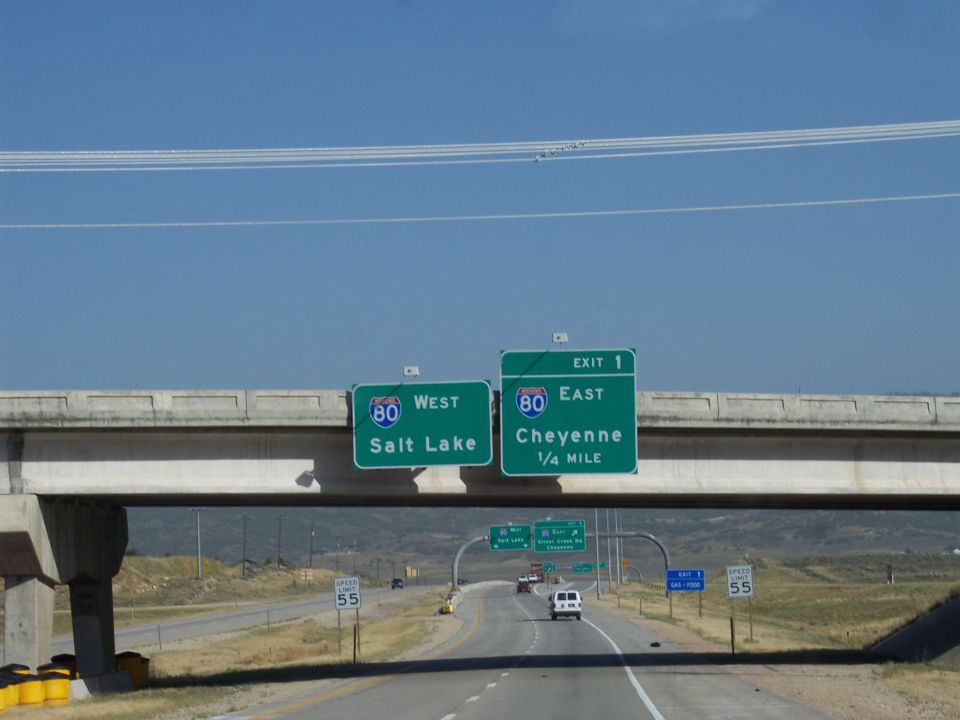 Highway signs for I-80 West to Salt Lake and I-80 East to Cheyenne