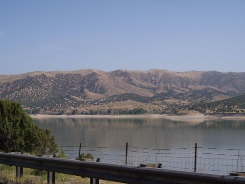 1972 Ford Ranchero - A wide view of a lake with mountains in the background, taken from a roadside vantage point.