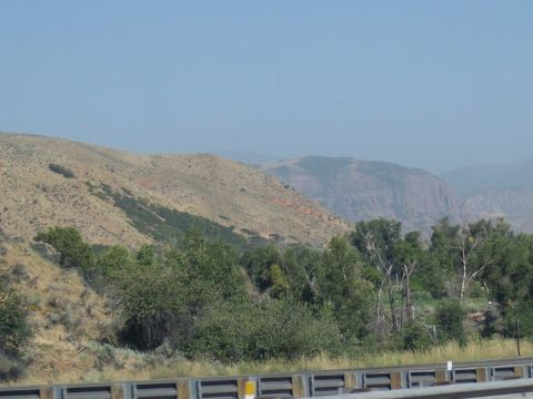 1972 Ford Ranchero - A scenic view of a mountainous region with sparse vegetation and a clear sky overhead.