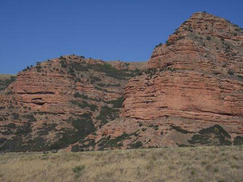 1972 Ford Ranchero - Expansive view of arid landscape layered rock formations and sparse vegetation.