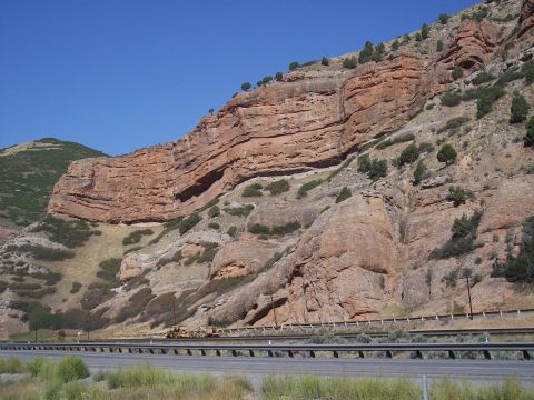 1972 Ford Ranchero - A vast, layered rock formation dominates the landscape under a clear blue sky.